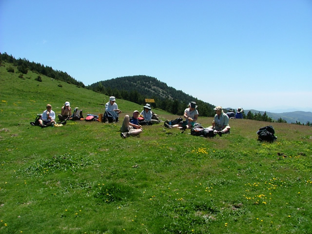 A guided walking group relaxing for lunch